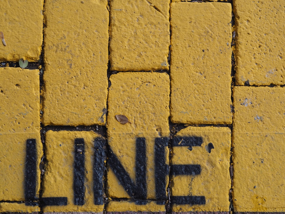 a close up of a street sign on a sidewalk