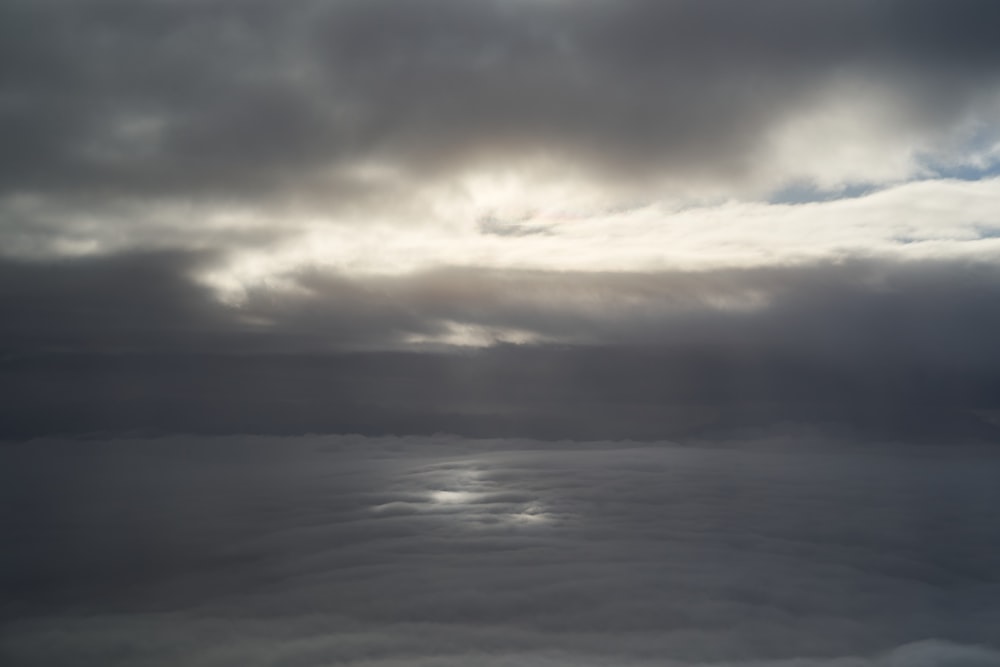 body of water under cloudy sky during daytime