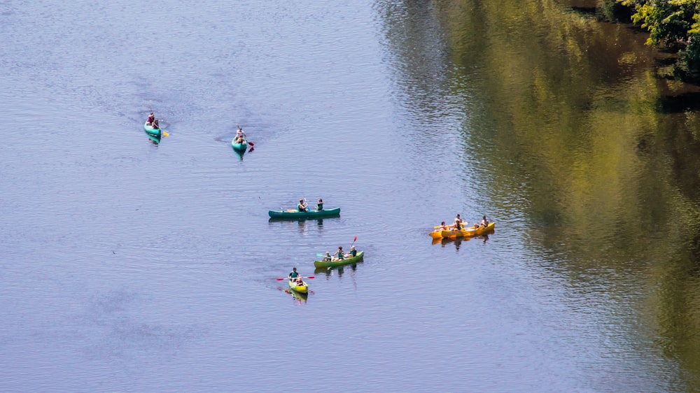 people riding on kayak on river during daytime