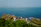 Group of happy travelers exploring the coastline of Príncipe island