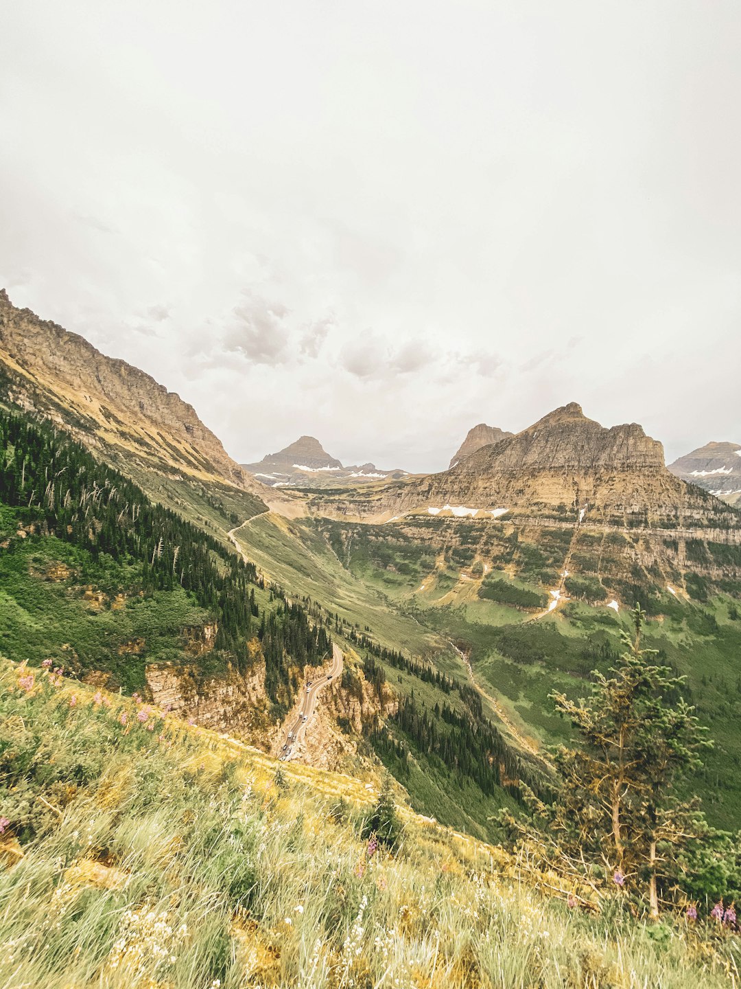 green and brown mountains under white cloudy sky during daytime