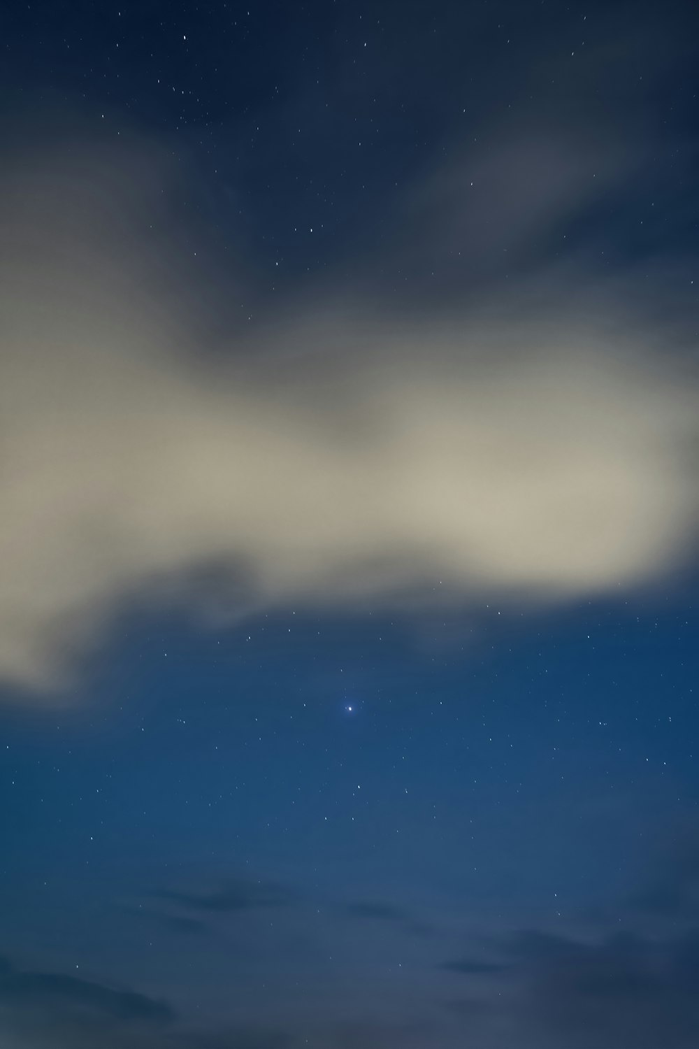 white clouds and blue sky during night time