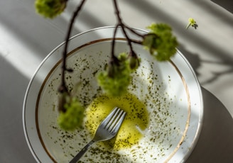 green vegetable on white and blue ceramic plate