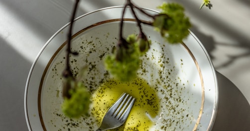 green vegetable on white and blue ceramic plate