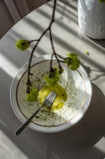 green vegetable on white and blue ceramic plate