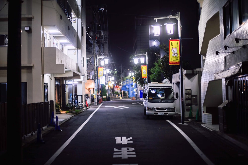 white van on road during night time