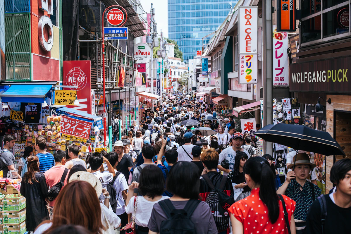 People walking through a shopping street in Tokyo. Major Tama stations have lively commercial areas of their own