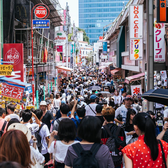 Shoppers walking down Takeshita Street in Tokyo during the day