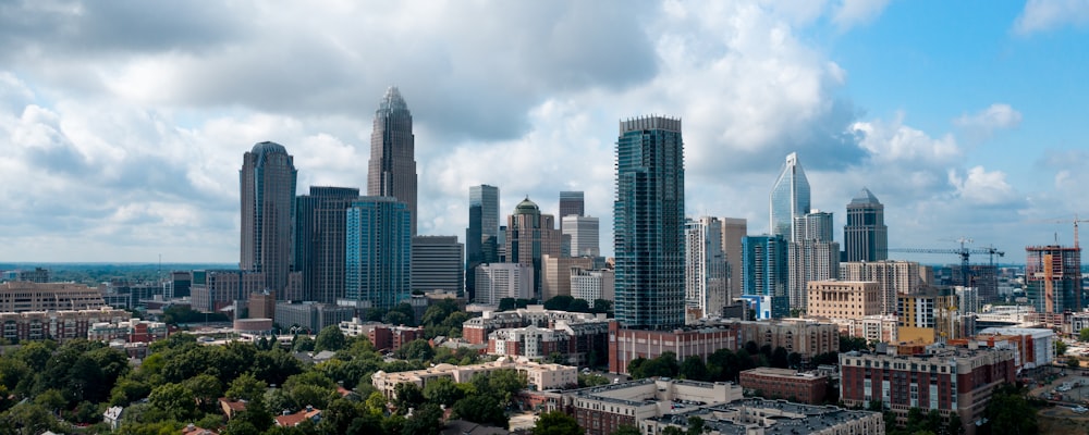 city skyline under white cloudy sky during daytime