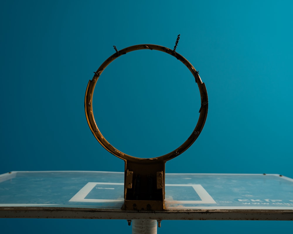 white basketball hoop on white wooden dock during daytime