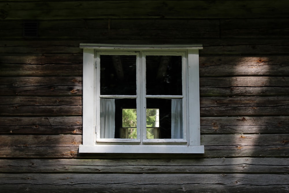 white wooden framed glass window