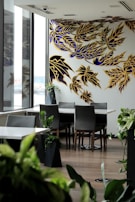 Close-up of a vibrant floral wallpaper pattern adding color and life to a modern dining area.