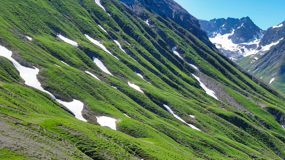 green and white mountains under blue sky during daytime