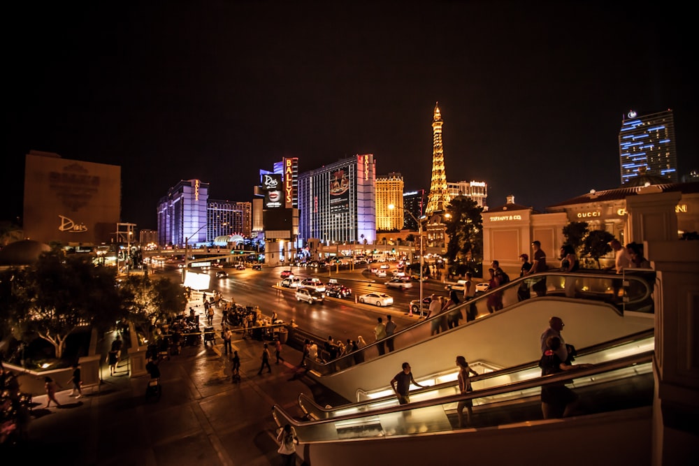 people walking on street during night time