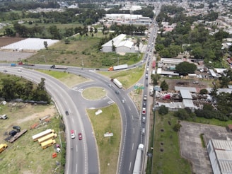 A panoramic shot of a major road interchange with vehicles smoothly flowing in multiple directions.