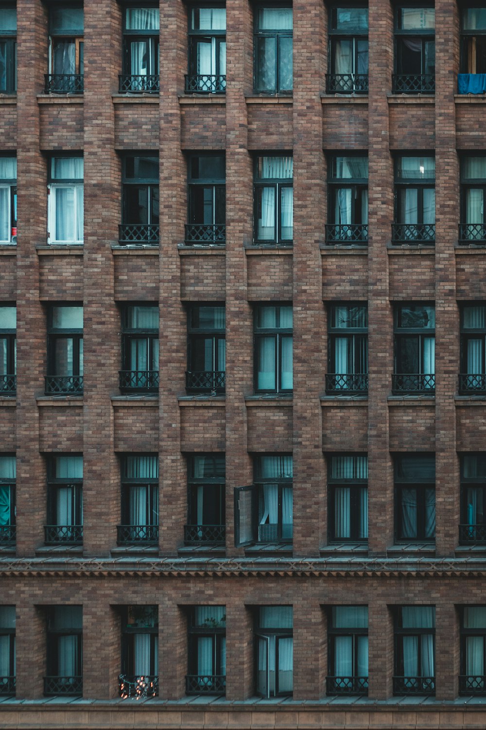 brown brick building with glass windows