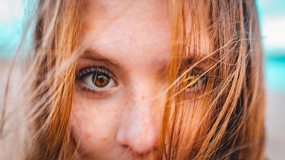 woman with brown hair taking selfie