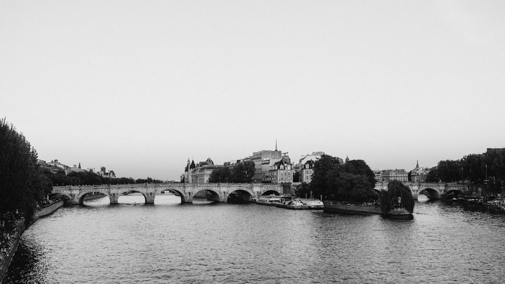 grayscale photo of bridge over river