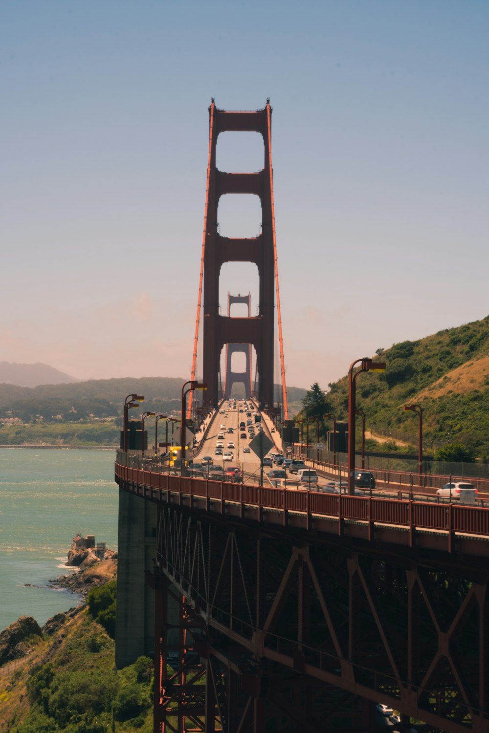 brown bridge over the sea during daytime