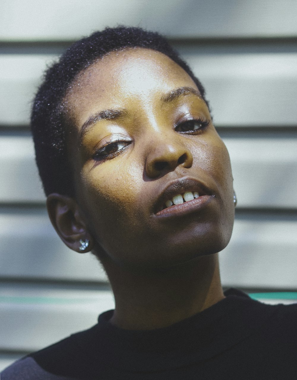 a close up of a person wearing a black shirt