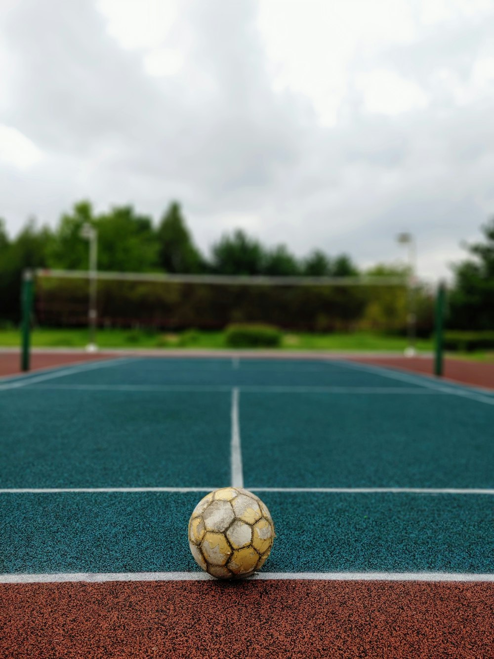 white soccer ball on green field during daytime