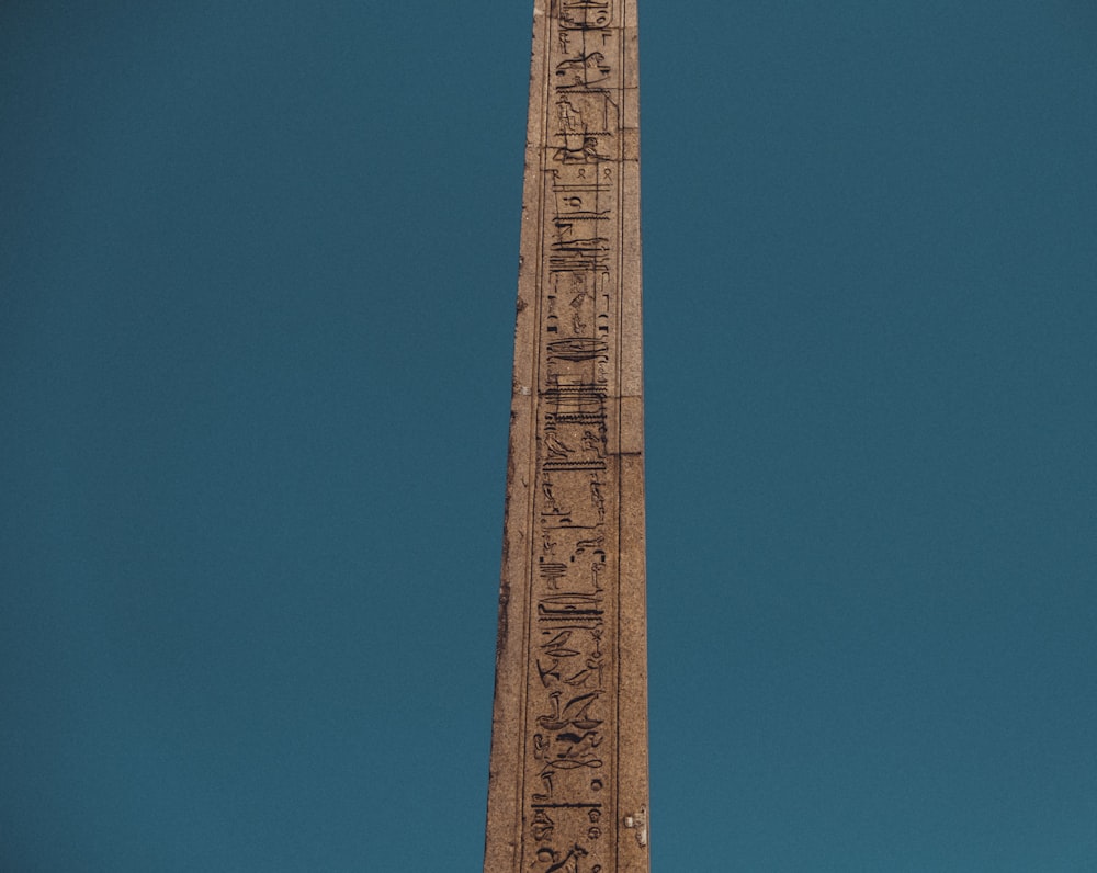 brown metal tower under blue sky