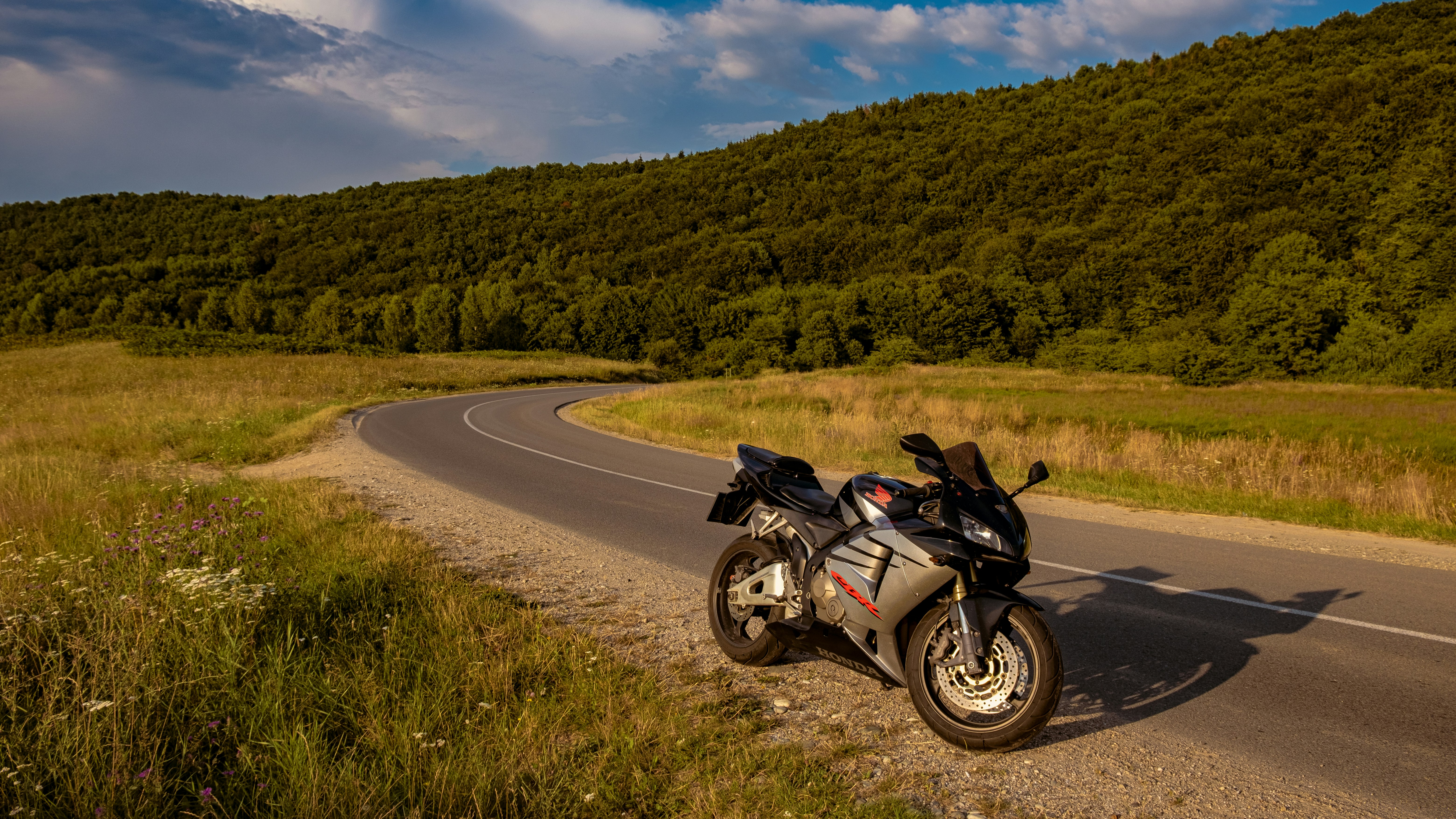 black and white sports bike on road during daytime