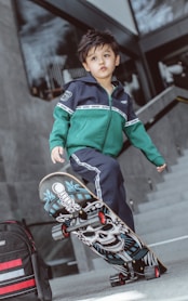 boy in green and blue zip up jacket riding on red and black motorcycle