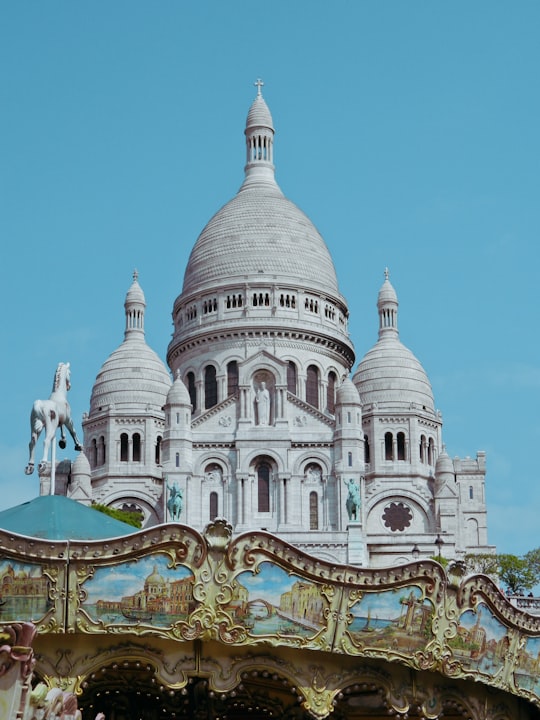 white concrete building under blue sky during daytime in Sacré-Cœur France