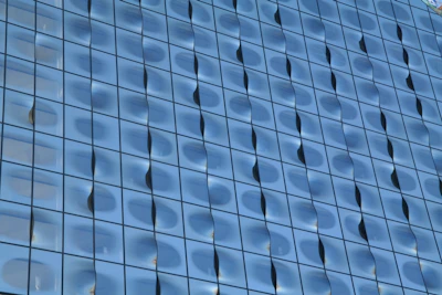 A detailed view of elegant glass panels being installed in a modern building facade.