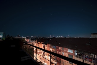 Night view of premium property with city lights.