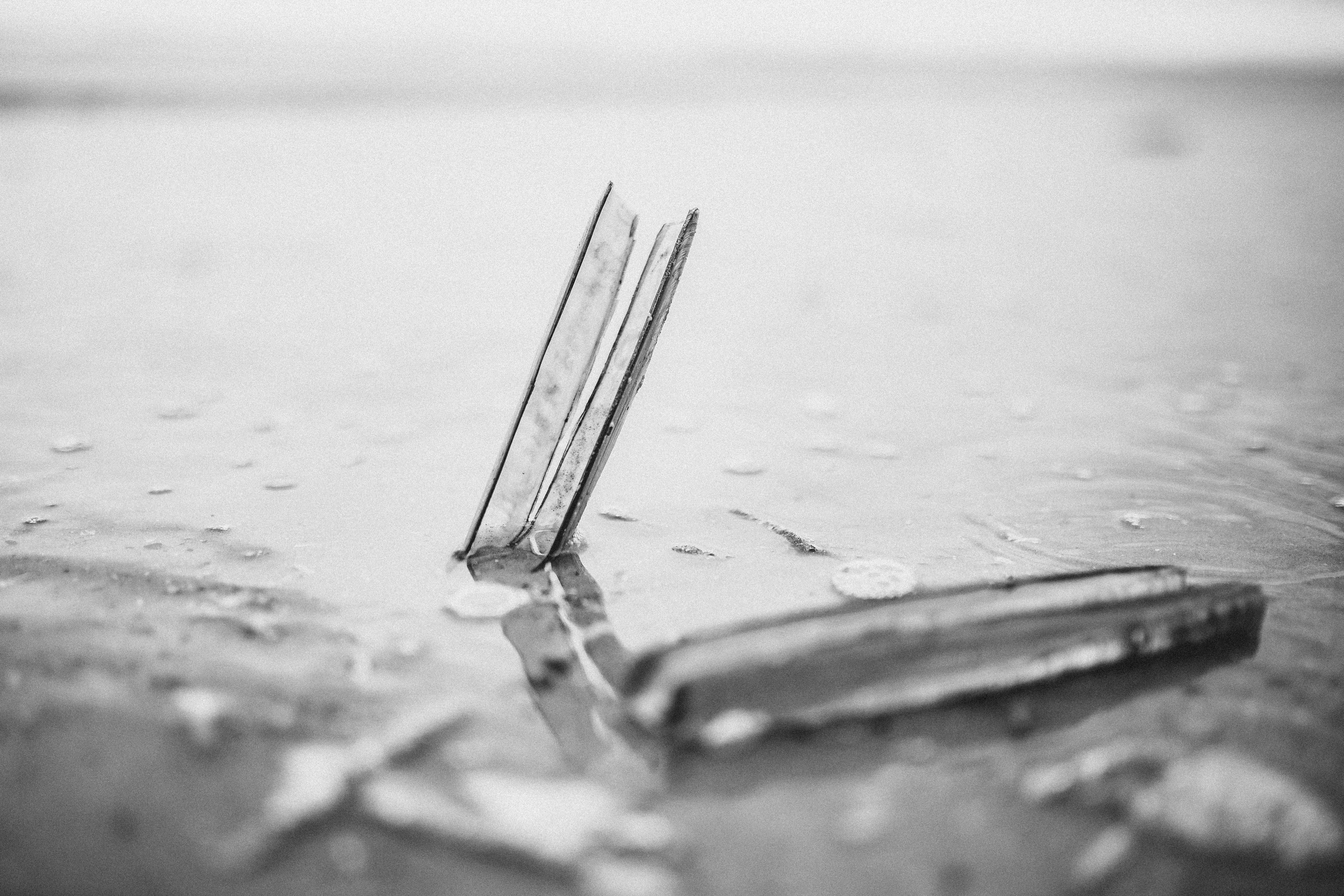 grayscale photo of a broken glass