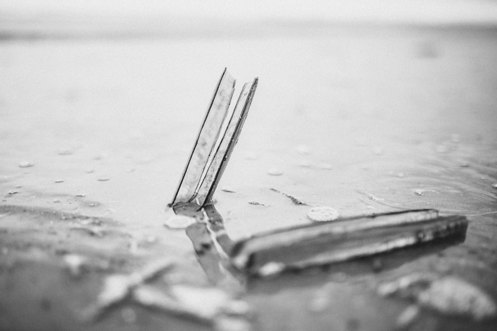 grayscale photo of a broken glass
