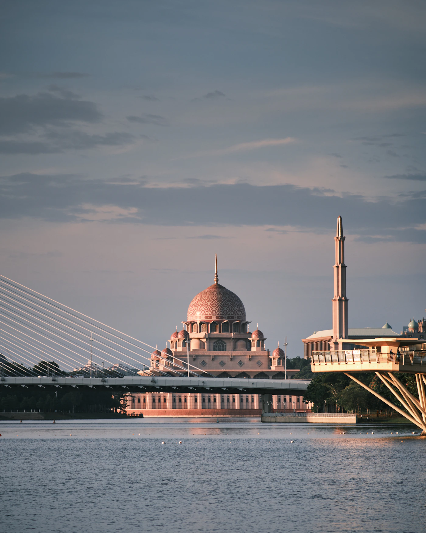 Putra Mosque beside the lake at golden hour in Putrajaya, Malaysia