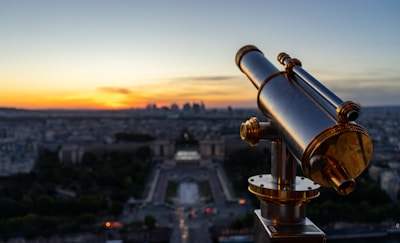 black and gold telescope during daytime