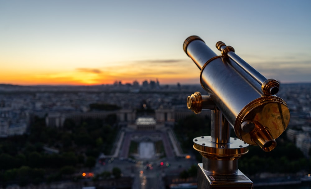 black and gold telescope during daytime