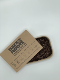 Close-up of sleek, industrial packaging showcasing Terra Vita Global's branded fertilizers and seeds.