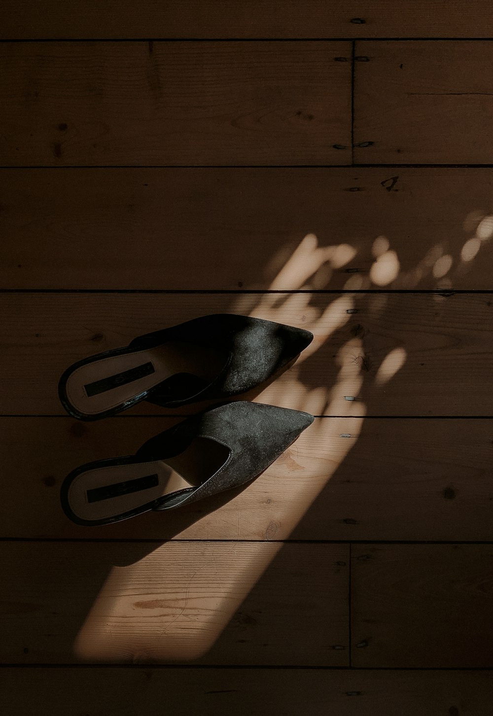 black metal tool on brown wooden floor