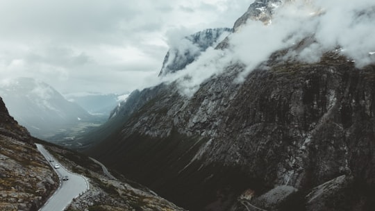 black and white mountains under white clouds in Trollstigen Norway