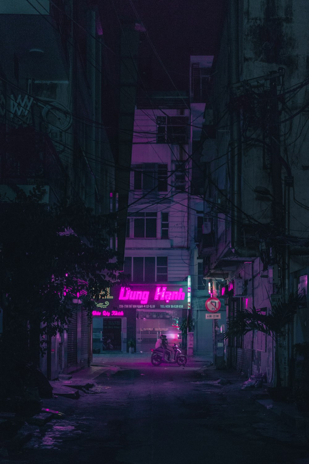 red car parked near building during night time