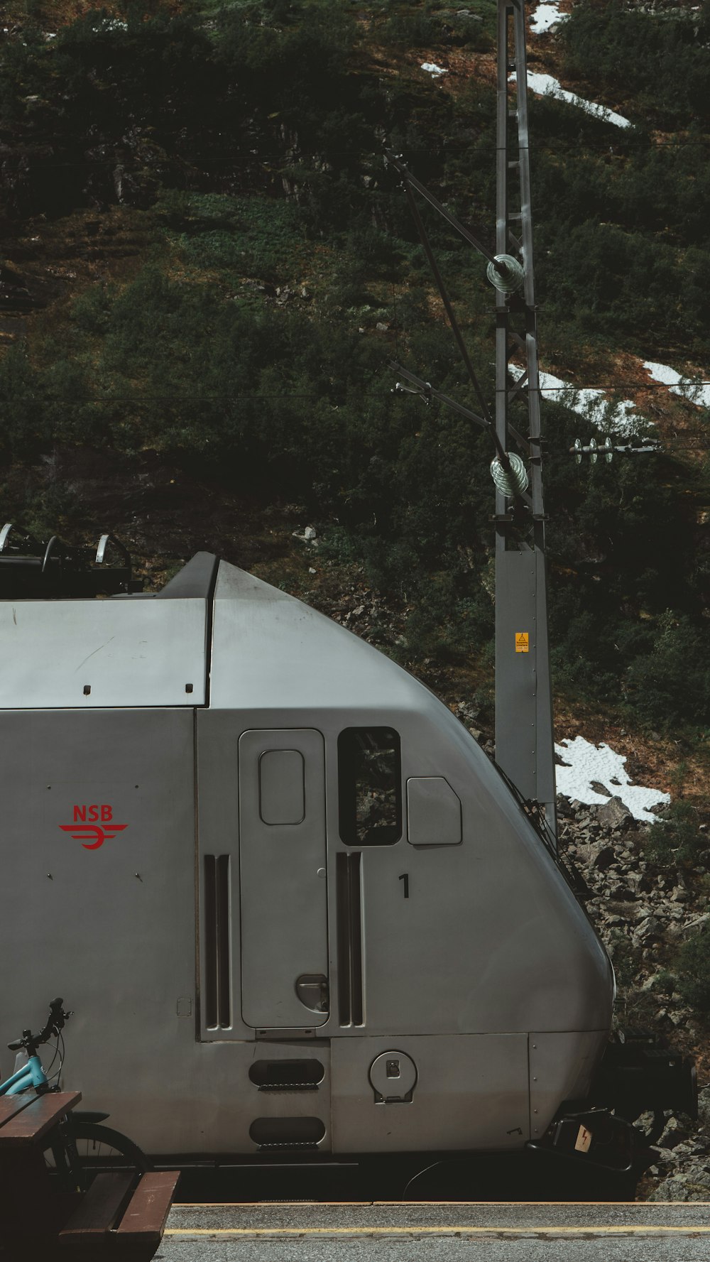 white and red train on rail