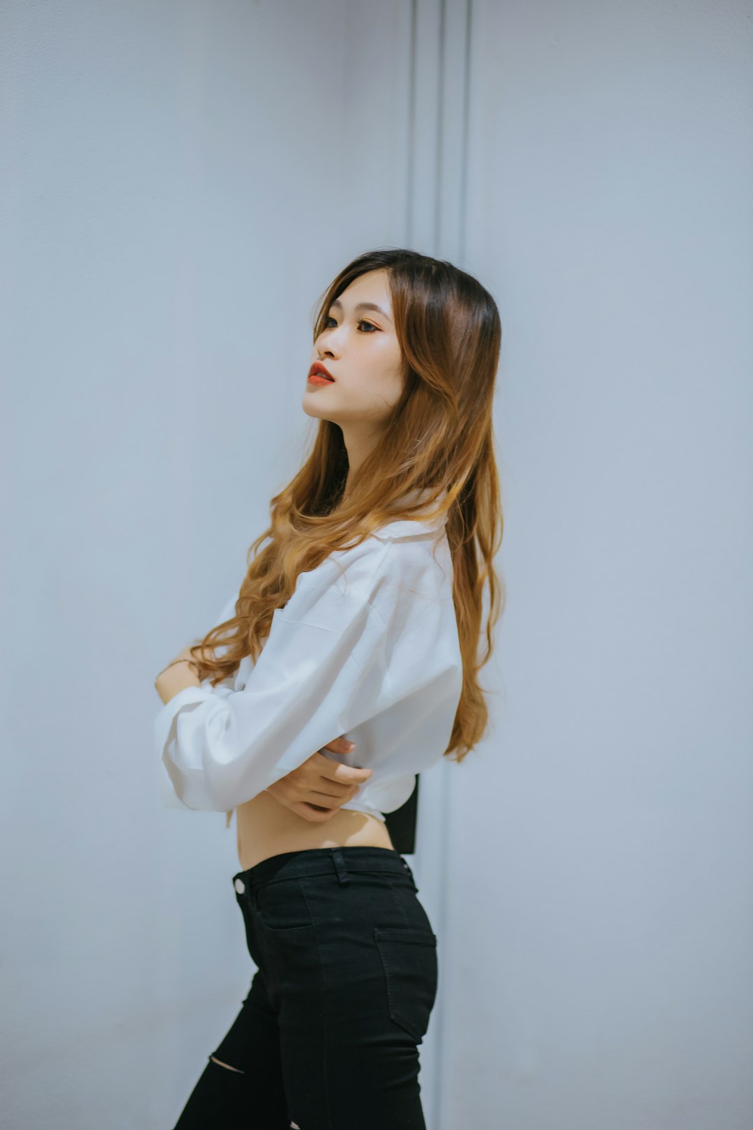 woman in white long sleeve shirt and black skirt