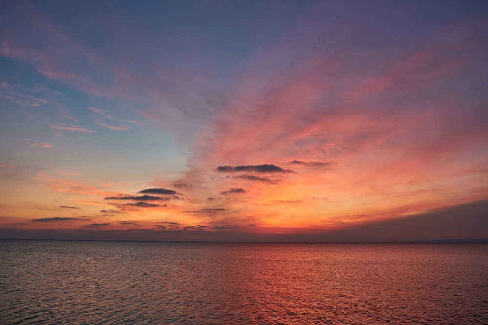 body of water under blue sky during daytime