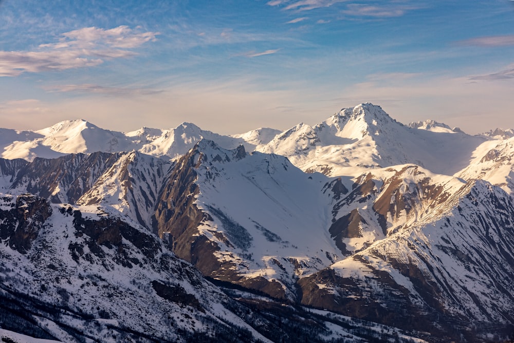 snow covered mountains during daytime