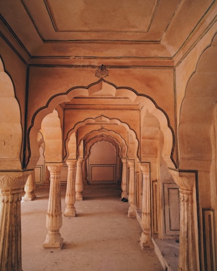 Interior hallway showcasing a blend of warm tones and artistic wall textures.