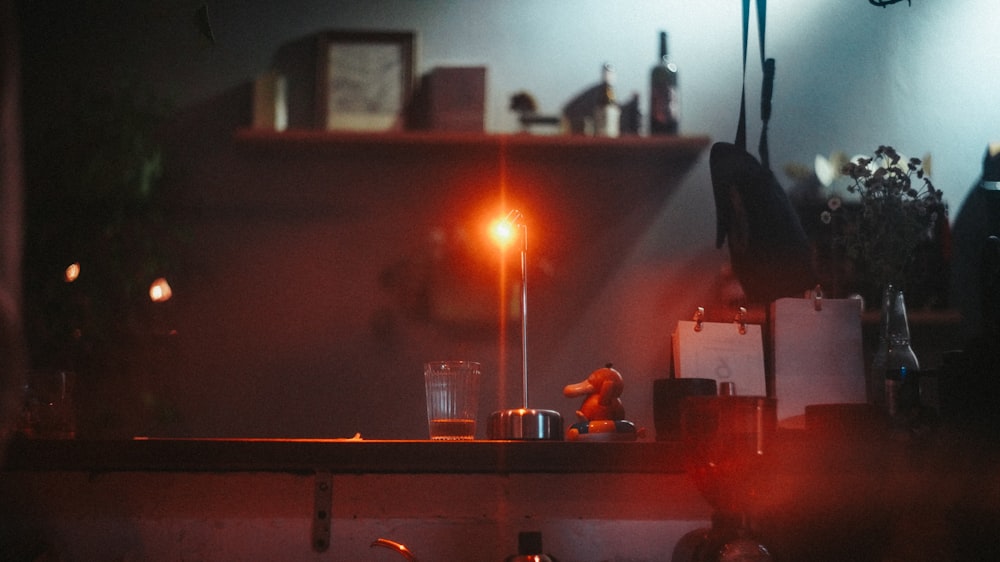 lighted candle on brown wooden table