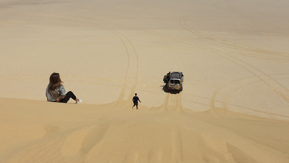 white suv on desert during daytime