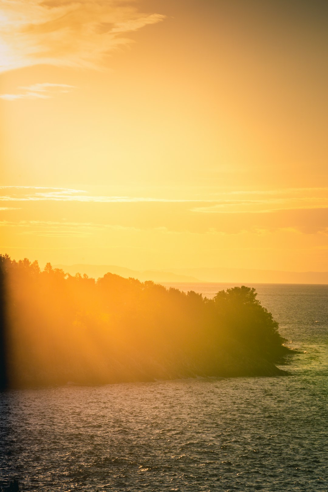 body of water during sunset