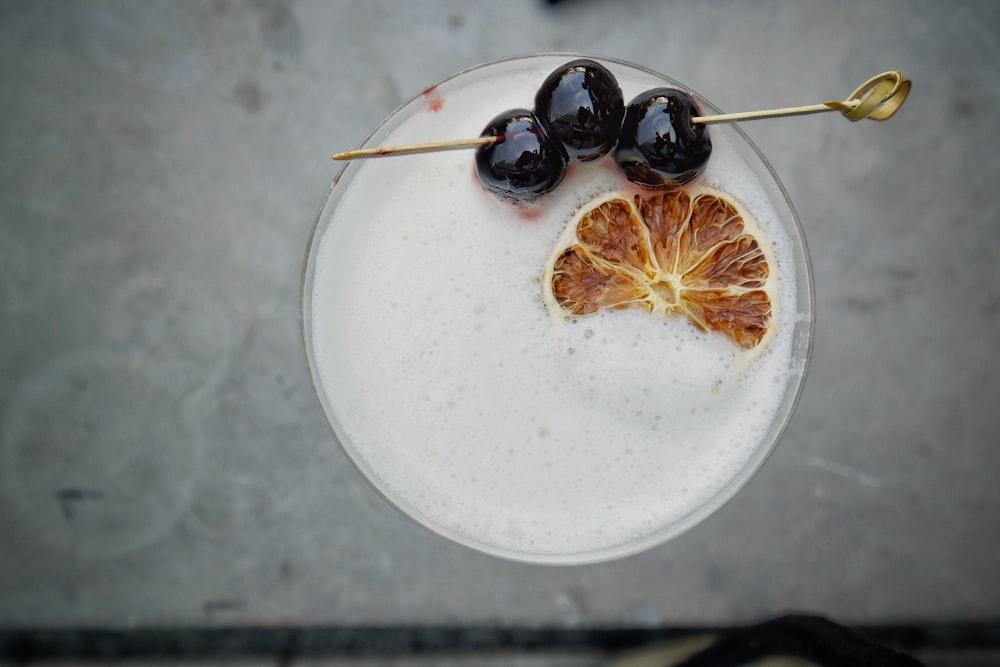 black berries on white ceramic plate