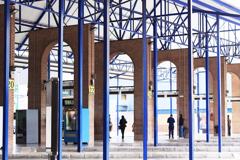 people walking on hallway of building